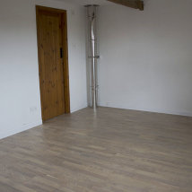 A Bedroom wtih Engineered Oak finished with a white UV Oil.